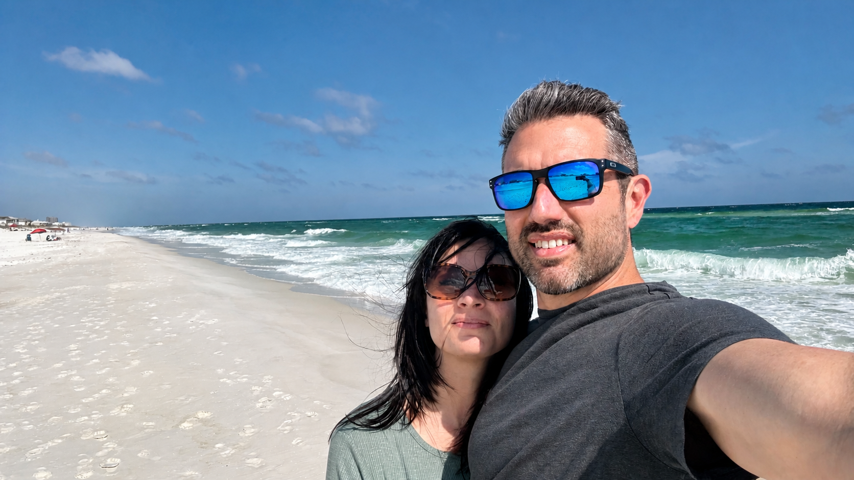 A couple enjoying a sunny day at the beach